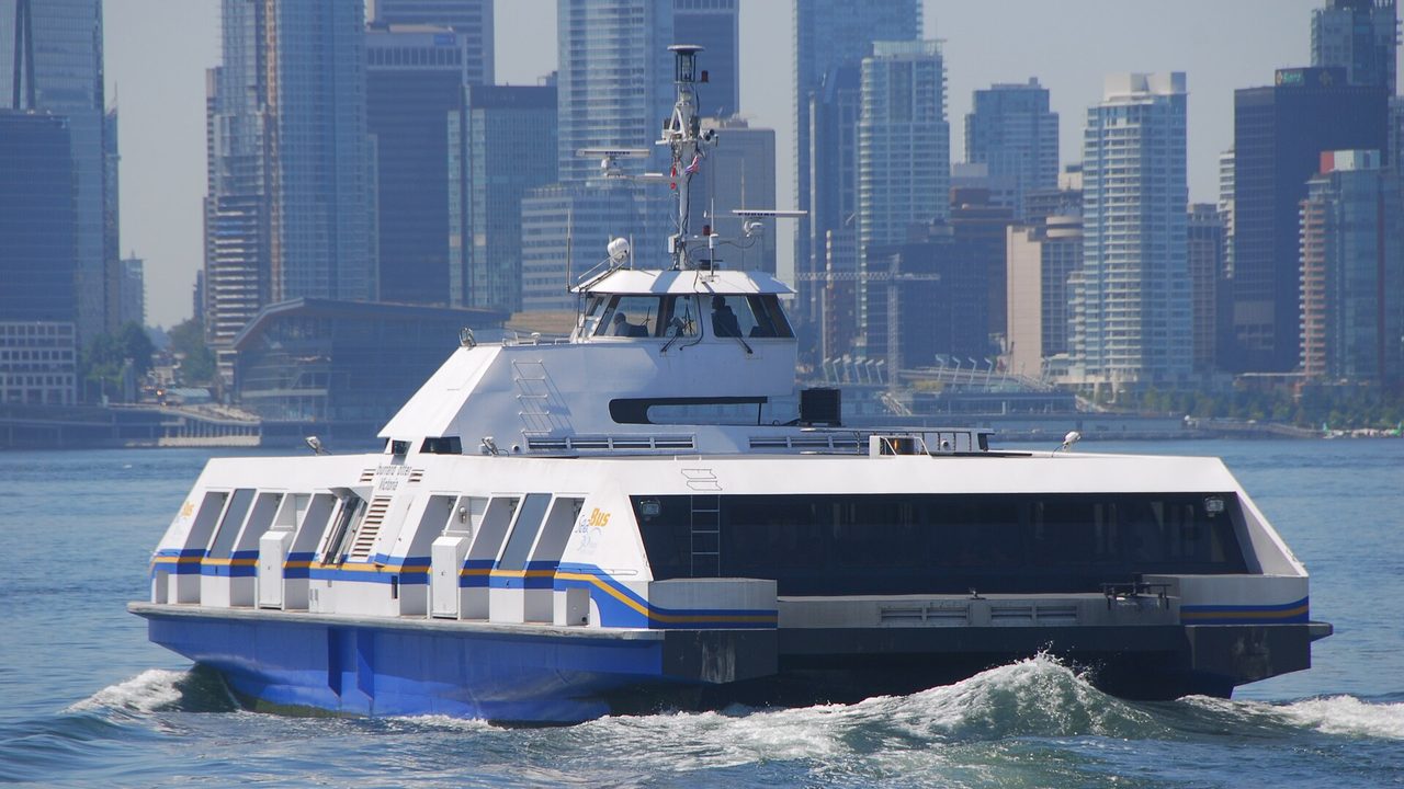 The SeaBus Burrard Otter crossing Burrard Inlet in front of the Vancouver skyline